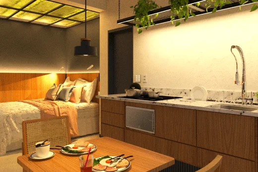 A imagem mostra um interior de quarto contemporâneo com uma cama de cabeceira azul diante de uma parede de tijolos escuros. Acima da cama, um letreiro neon azul destaca a frase "WAKE UP! YOU ARE IN RIO!", criando um ponto focal vibrante e convidativo. Iluminação embutida branca adiciona um toque moderno ao teto, enquanto uma porta de correr de madeira e vidro fosco ao fundo leva a uma cozinha compacta com armários azuis e cadeiras amarelas, conferindo ao espaço um ar acolhedor e estiloso.